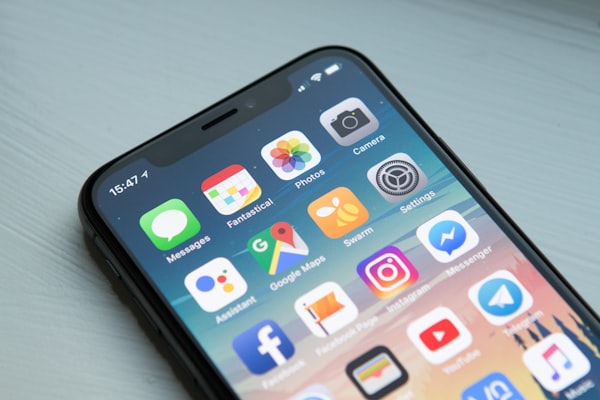 Person using smartphone for mobile plans